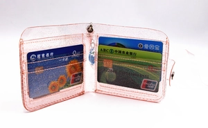 Pink glitter PVC folding card holder with transparent pockets and metal snap button closure