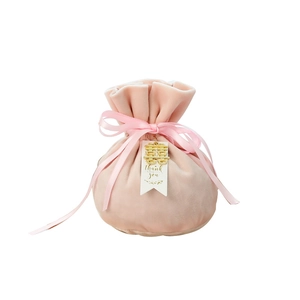 Pink velvet wedding favor bag with gold double happiness tag and pink ribbon bow