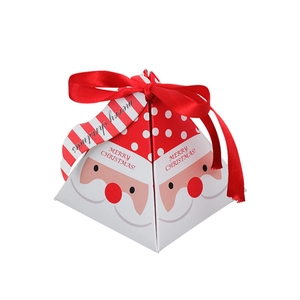 Pyramid Christmas gift box featuring Santa Claus face and festive red ribbon on white base