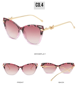Cat eye sunglasses detail with pink leopard frame, gradient lenses and butterfly hinge