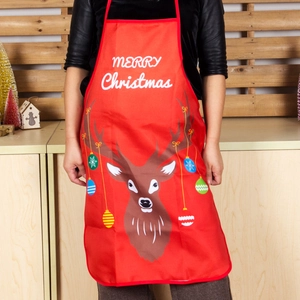 Red Christmas apron featuring reindeer print and Merry Christmas text for festive kitchen use
