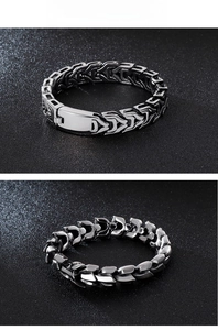 Detailed close-up of a men's titanium steel dragon bone chain bracelet with safety clasp