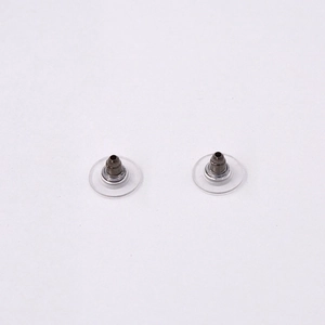 Close-up of universal silicone and metal earring back stoppers with clear disk pad