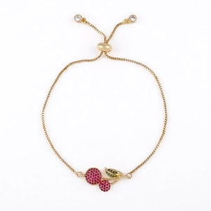 Gold adjustable cherry bracelet with sparkling red and green cubic zirconia stones
