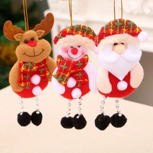 Three plush Christmas ornaments featuring Santa, Snowman, and Reindeer on a tree