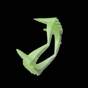 Fluorescent green plastic vampire teeth for Halloween costumes and party decorations