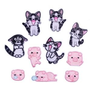 Detailed embroidery patches set featuring cute pink pigs and striped cats for DIY crafts