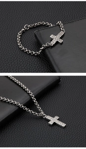 Macro view of vintage silver cross pendant with unique hammered texture on leather