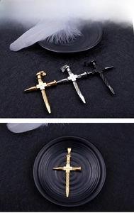 Detailed macro of twisted rope texture and cross structure on men's titanium steel pendant