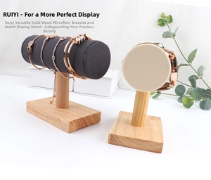 Close-up of wooden jewelry display stand with microfiber roll for bracelets and watches