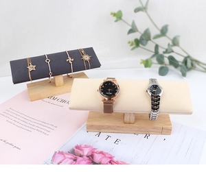 Solid wood jewelry display stands in dark grey and cream velvet for watches and bracelets