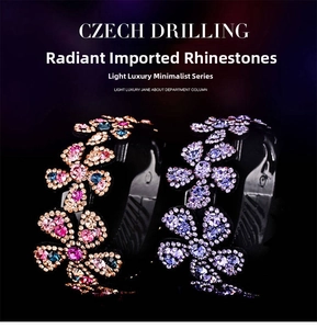Detailed close-up of sparkling floral hair clip with multicolored Czech crystal accents