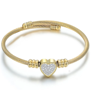 Golden cable twist open cuff bracelet with a sparkling heart-shaped zircon pendant