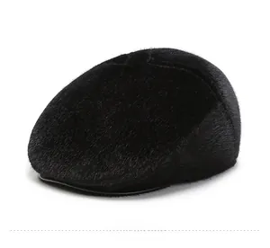 Detail view of winter flat cap showing the thick black faux fur texture and brim