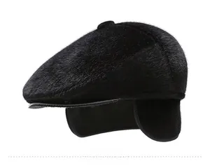 Detail view of the plush thermal ear flaps and thick lining on the black winter flat cap