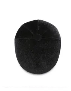 Top view of black faux mink fur flat cap showing soft texture and premium thermal material
