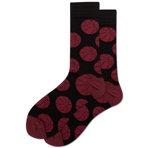 Detail of black mid-calf socks featuring red basketball patterns and ribbed cuffs