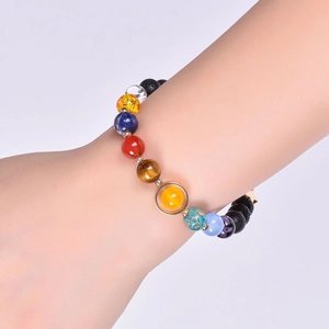 Solar system solar galaxy bead bracelet with natural lava and stone on a model's wrist