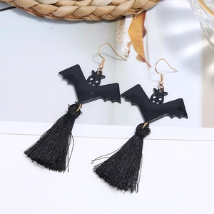 Detail of Halloween bat earrings featuring black silk tassels and gold-tone hooks