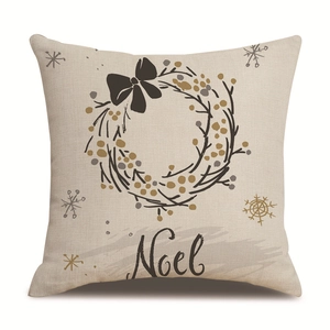 Christmas linen pillowcase with Noel wreath and black bow on a white background