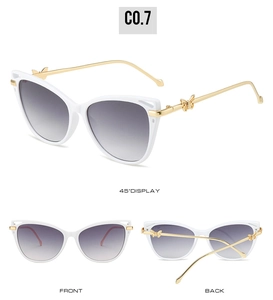 Three-angle view of white cat-eye sunglasses with gold metal butterfly temple details