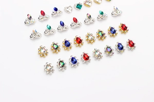 Close-up of alloy crown and teardrop rhinestones in gold and silver settings