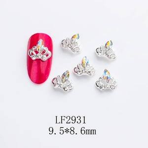 Detail of silver crown nail art charms with iridescent rhinestones and size labels