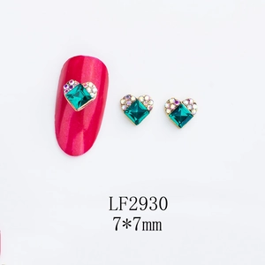 Nail art decoration LF2930 showing square green gem with gold heart base and rhinestones