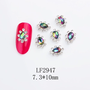 Macro shot of 6pcs AB crystal crown nail charms with teardrop shape for nail art