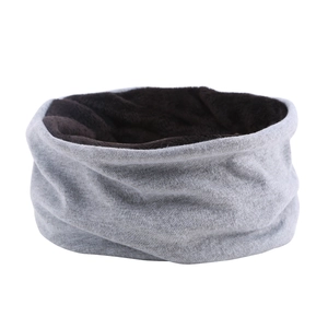 Detail of grey knitted neck gaiter with soft dark brown fleece lining for warmth