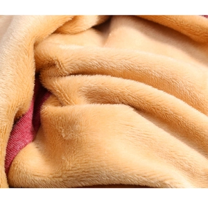 Detailed close-up showing the soft plush texture of the red and brown fleece beanies