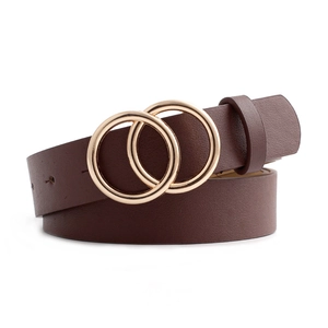 Dark brown leather belt with gold double ring buckle shown in a rolled aesthetic