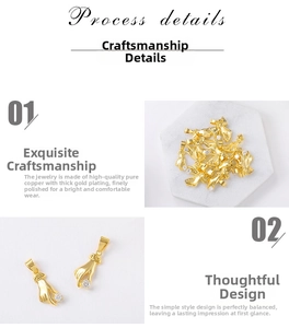 Detailed macro view of gold-plated copper hand charm with sparkling cubic zirconia inlay