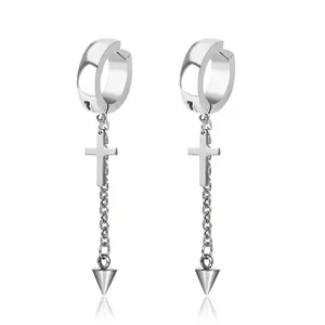Silver punk cross earrings with spike charms and thin chains on a reflective background