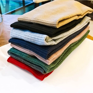 Knitted ribbed yoga headband set in eight colors shown from a 45-degree angle