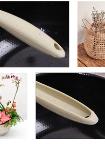 Detail of beige wheat straw handle with hanging hole for kitchen cleaning brush set