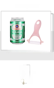 Pink Y-shaped ceramic vegetable peeler size comparison with a 330ml soda can