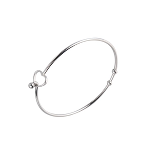 Detailed view of silver stainless steel open bangle with hollow heart and bead charm