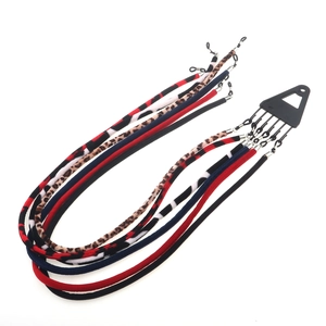 5-pack sports eyewear straps with diverse leopard and floral patterns on display card