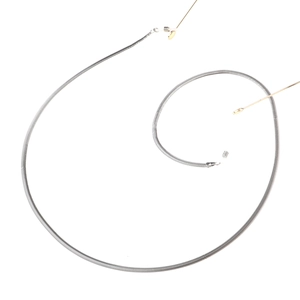 Detail shot of silver snake chain eyewear lanyard with adjustable clear rubber loop ends