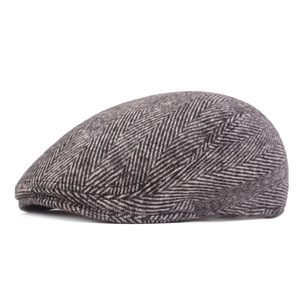 Classic grey herringbone newsboy cap for men featuring premium wool-like textured fabric