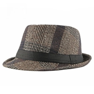 Detailed view of autumn winter houndstooth fedora hat with black grosgrain ribbon band