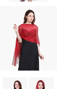 Detail of red evening shawl with metallic shimmer mesh and elegant tassel fringe trim