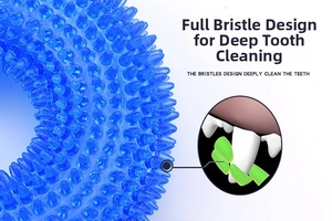 Detailed macro view of the blue TPR dog toy showing the durable spikes for deep tooth cleaning