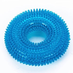 Macro detail of blue translucent TPR dog chew ring showing soft dental massage spikes