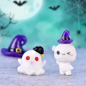 Miniature Halloween resin figurines featuring a cute white ghost and a mummy in witch hats