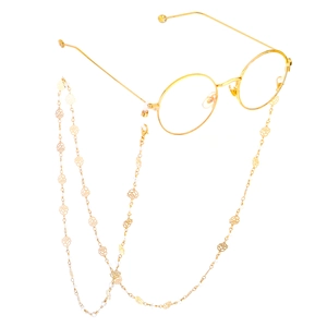 Gold rose crystal eyewear chain with round glasses in a minimalist aesthetic style