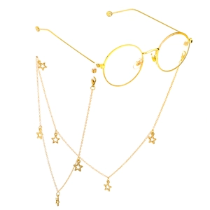Close-up of golden round sunglasses frame with star pendant chain on a white background
