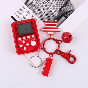 Portachiavi mini console di gioco Tetris rosso trasparente con ciondoli a stella e campanella