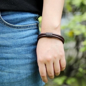 Retro braided brown cowhide leather bracelet with grey rope wrap detail on male wrist